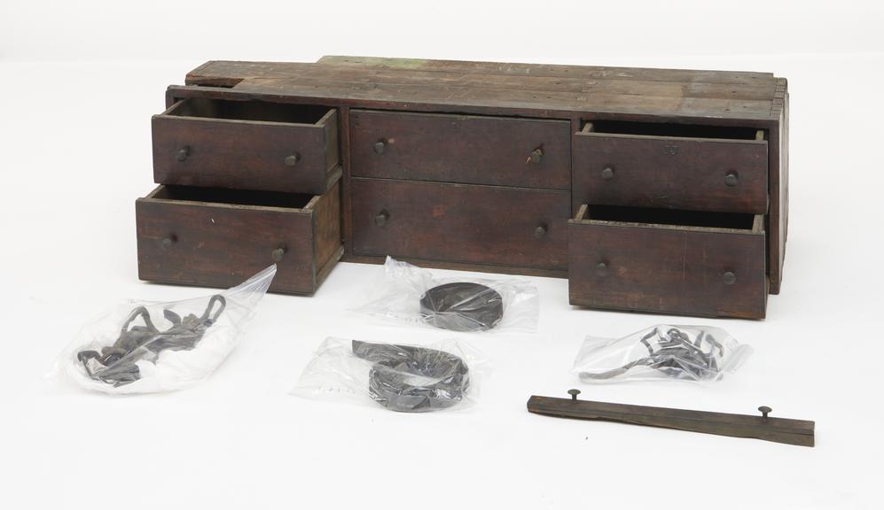 A pair of wooden drawer cabinets for tool storage