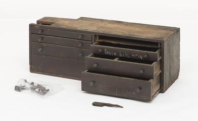 A pair of wooden drawer cabinets for tool storage