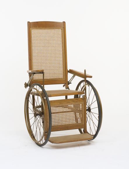Three-wheeled wooden framed wheelchair
