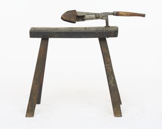 Bench for textile shears.
