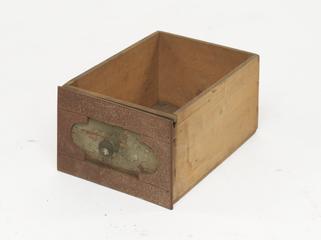 Wooden drawer with labels missing