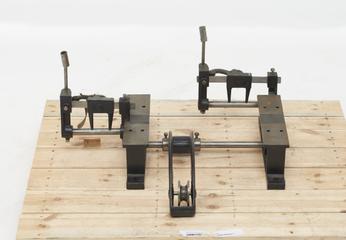 Pair of stools or hangers with two striking gears and jockey wheel in swing frame