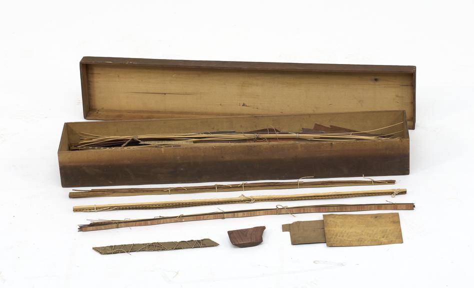 Box containing stringing pieces of veneer