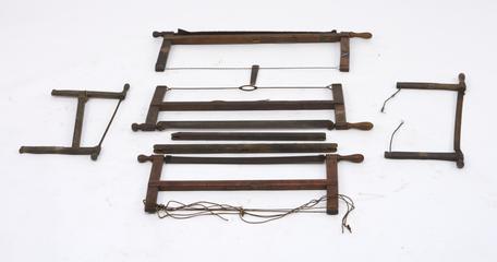 5 frame saws in varying states of repair