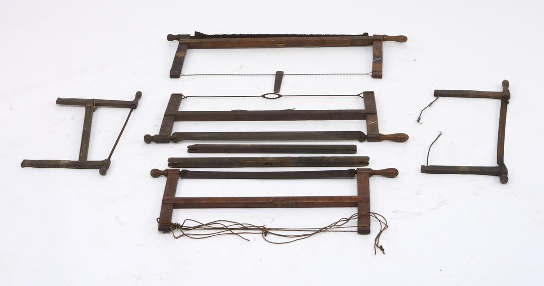 5 frame saws in varying states of repair