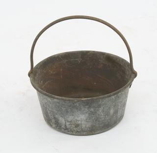 Brass pan with iron handle