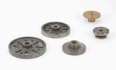 Two catch plates; two face plates and a adapter chuck.