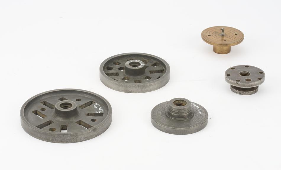 Two catch plates; two face plates and a adapter chuck.