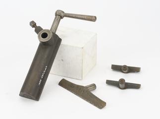 A hand rest and two seperate tees.