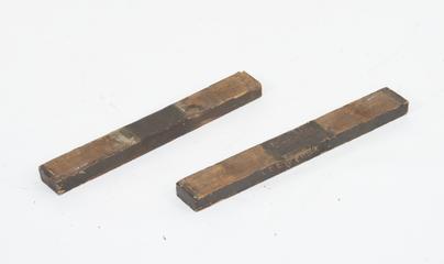 2 wooden bearers of unknown use