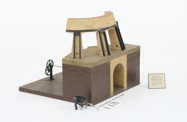 Sectional model of glass furnace with Frisbie feeder