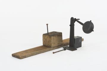 Clapper associated with the three cast bells set up in connection with the Wells cathedral clock