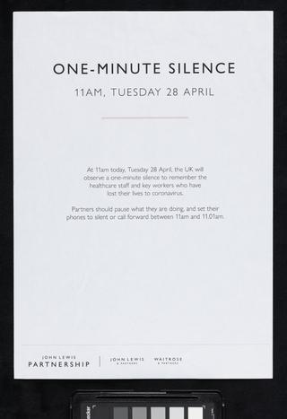 Staff sign notifying people of a one minute silence in memory of those who died from COVID-19