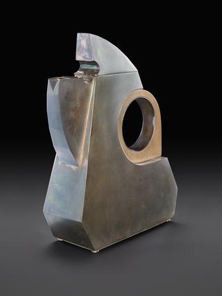 Silver coffee pot with wooden handle made by Helen Jordan