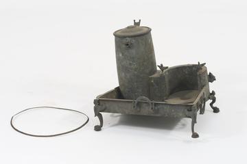 Bronze replica of a small furnace
