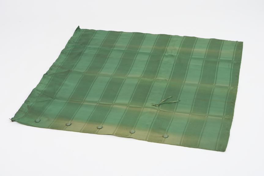 Curtain, green, from night compartment of railway carriage
