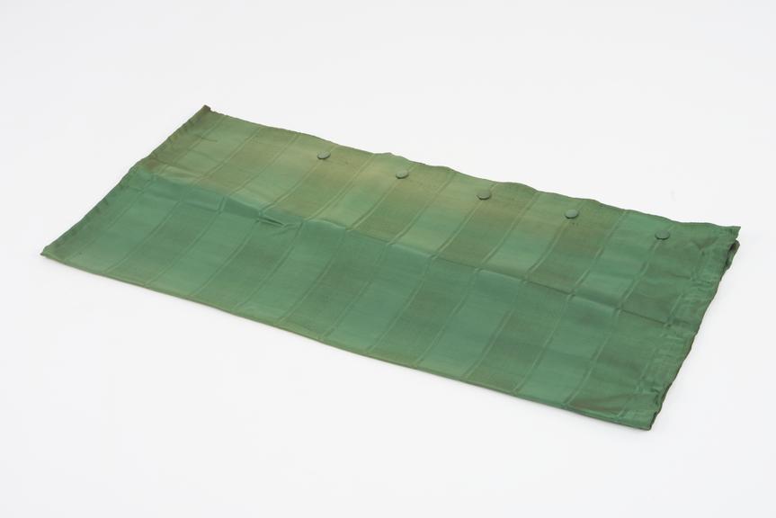 Curtain, green, from night compartment of railway carriage