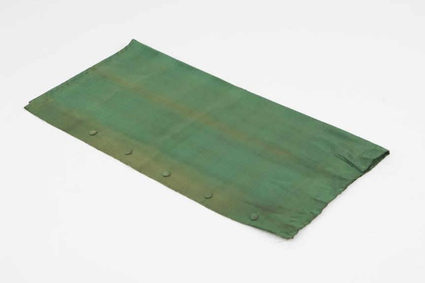 Curtain, green, from night compartment of railway carriage