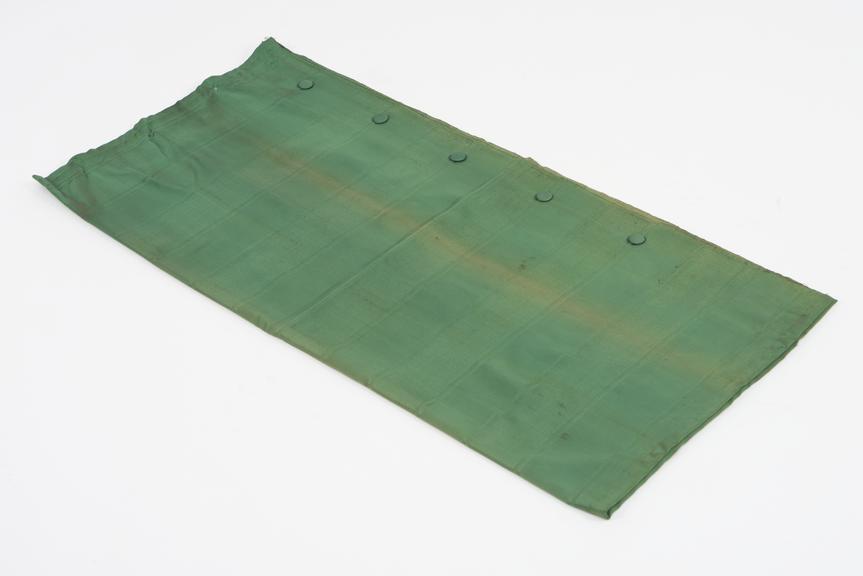 Curtain, green, from night compartment of railway carriage
