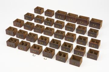 Wooden drawers and fittings from model Chinese pharmacy, China, 1881-1885