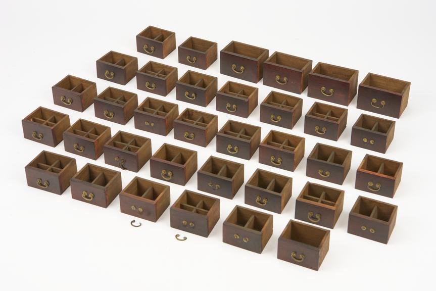 Wooden drawers and fittings from model Chinese pharmacy, China, 1881-1885