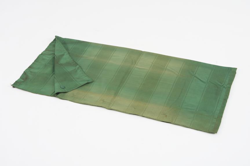 Curtain, green, from night compartment of railway carriage