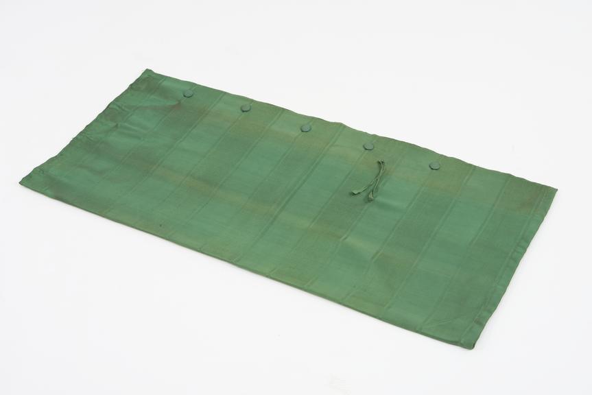 Curtain, green, from night compartment of railway carriage