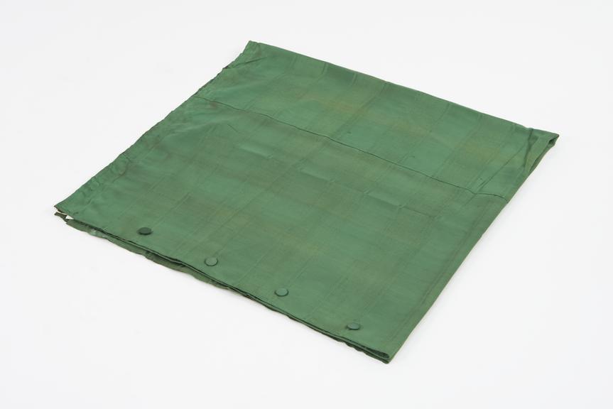 Curtain, green, from night compartment of railway carriage