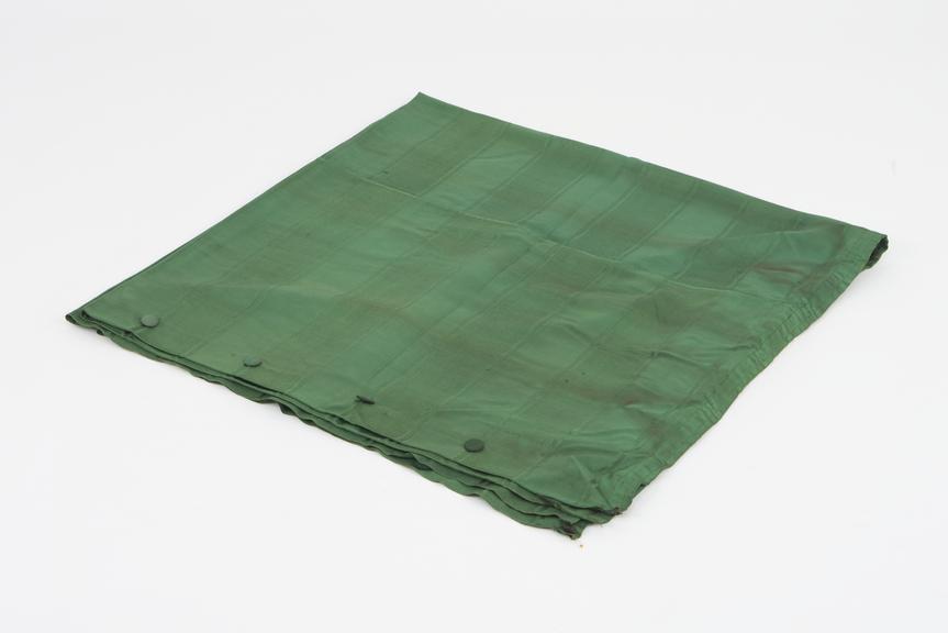 Curtain, green, from night compartment of railway carriage