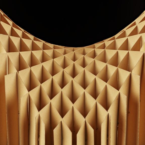 Assembled cardboard geometrical model on wooden display stand