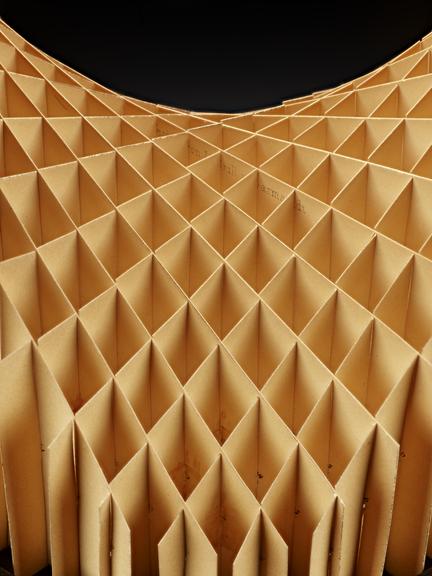 Assembled cardboard geometrical model on wooden display stand