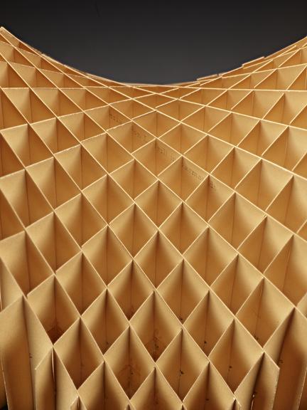 Assembled cardboard geometrical model on wooden display stand