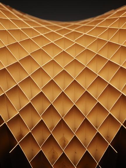 Assembled cardboard geometrical model on wooden display stand