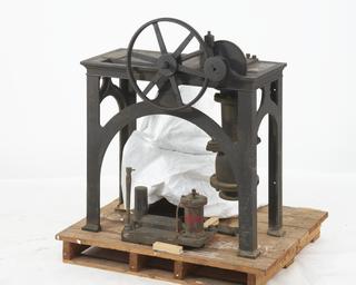 An iron table stand with suction pipe