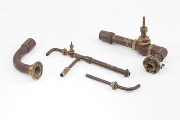 Four pieces of pipework with fittings