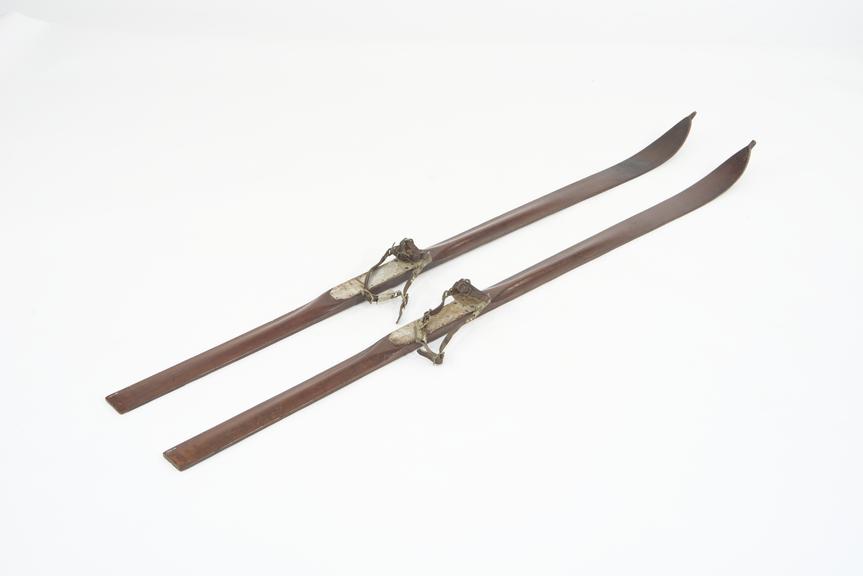 Pair of wooden skis with leather bindings