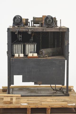 2 winding drums and electric motors on cabinet containing controller