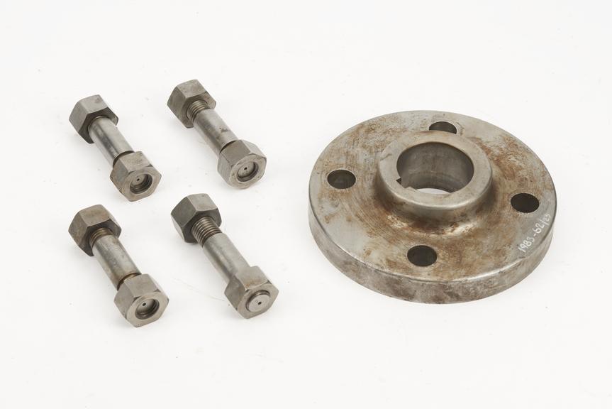Flange probably from original driving gear (shaft on /3) and four fitted studs stamped up to match