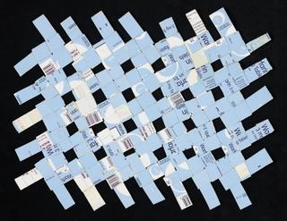 Woven mat created from cardboard light blue and white Warfarin medicine packaging