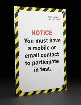 “NOTICE You must have a mobile or email” sign from Liverpool mass testing programme