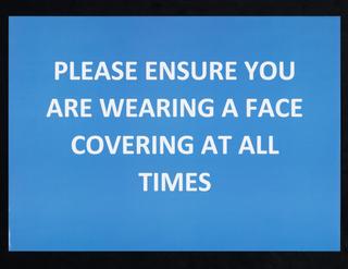 “PLEASE ENSURE YOU ARE WEARING A FACE COVERING” sign from Liverpool mass testing programme