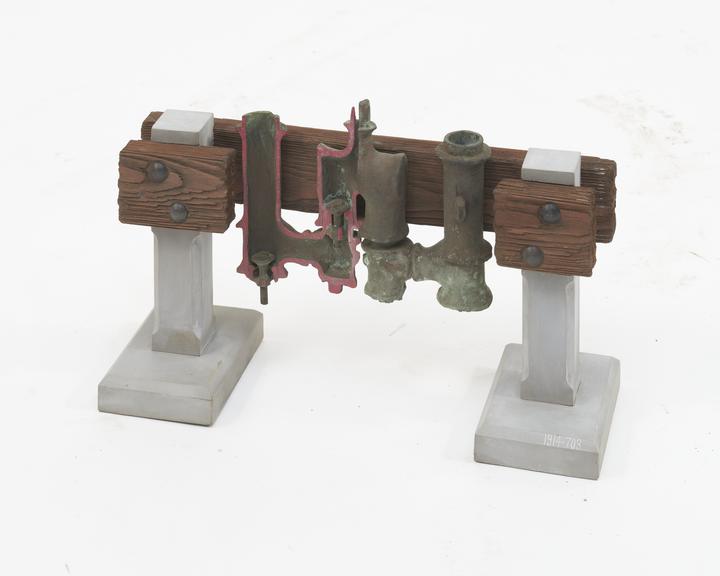 Reproduction in section of ancient Roman Plunger Pump with poppet valves