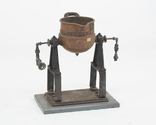 Kettle for making wax dyes.
