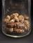 Specimen bottle containing castor-oil seeds