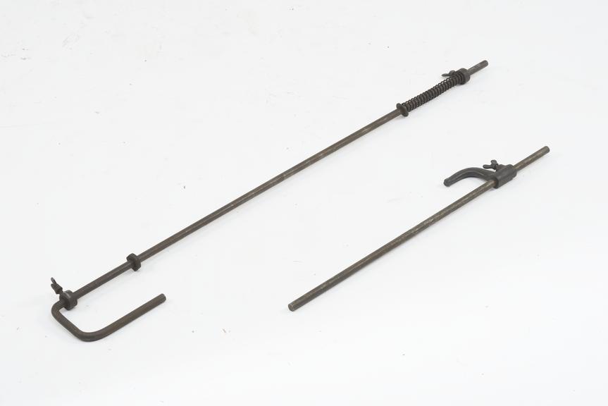 Steel rod 30" x 5/8" diameter with cast fitting clamped by a thumb screw
