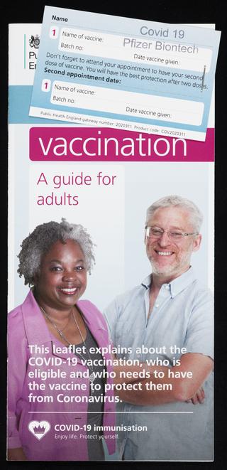 Public Health England vaccine card and 'A guide for adults' leaflet