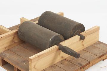 Two heavy wooden (lignum vitae ?) rollers on iron