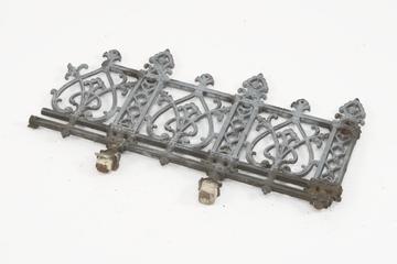 Cast iron railing with two fixing points, third broken off and top edge missing