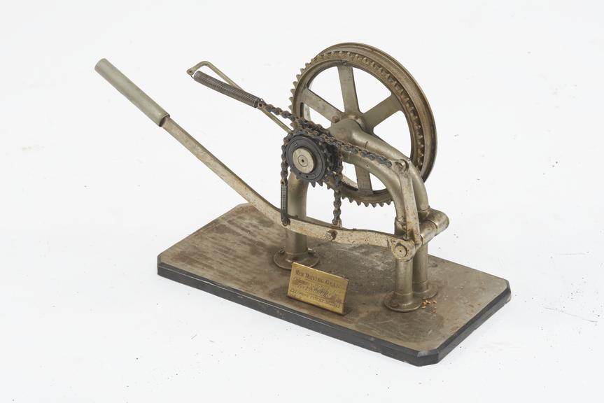 Hand operated double ratchet driving gear for obtaining rotative from reciprocating motion