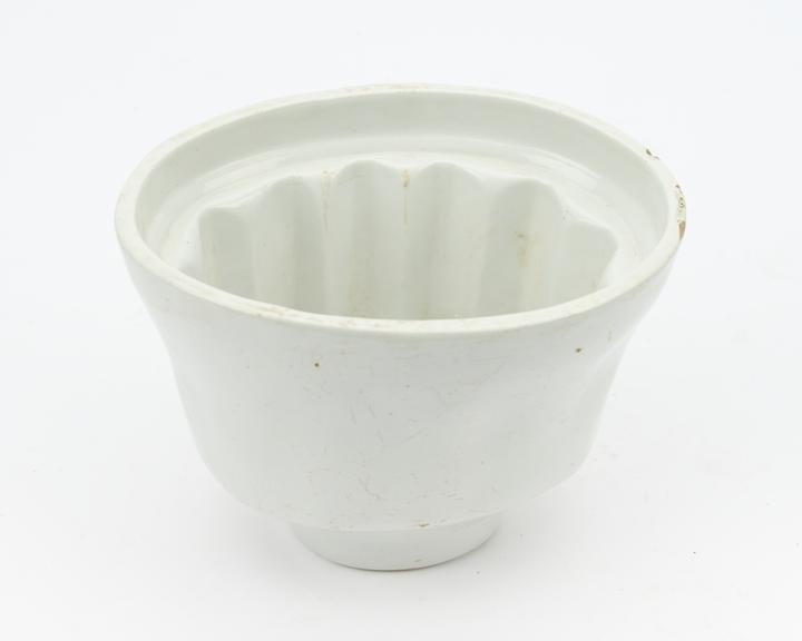 White glazed earthenware oval jelly mould